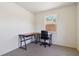 This office features a desk, an office chair and natural light from the window at 105 Biscayne Dr, Port Charlotte, FL 33953