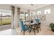 Dining room showcasing glass table and scenic view with elegant window treatments at 1132 Moss Cove Ct, Port Charlotte, FL 33953