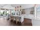 Modern kitchenette featuring an island with bar seating and stainless steel appliances at 1132 Moss Cove Ct, Port Charlotte, FL 33953