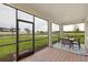 Screened lanai with view, perfect for outdoor dining and relaxation at 1132 Moss Cove Ct, Port Charlotte, FL 33953