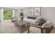 Bright living room with stylish furniture, neutral tones, and a sliding glass door to the outdoors at 1132 Moss Cove Ct, Port Charlotte, FL 33953