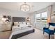 Serene main bedroom with plush bedding, natural light, and elegant decor at 1132 Moss Cove Ct, Port Charlotte, FL 33953