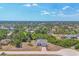 Residential neighborhood showcasing various homes surrounded by trees and shrubbery, blending nature at 118 Boxwood Ln, Rotonda West, FL 33947