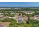 Property with a screened-in pool, partially surrounded by mature trees and shrubbery at 118 Boxwood Ln, Rotonda West, FL 33947