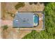 Aerial view of a home with screened in pool and fenced backyard providing privacy at 118 Boxwood Ln, Rotonda West, FL 33947
