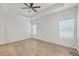 Bright bedroom with tile floors, a ceiling fan, natural light, and neutral decor at 118 Boxwood Ln, Rotonda West, FL 33947