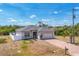 Charming single-Gathering home with a well-maintained lawn, a two-car garage, and a brick-paved driveway at 118 Boxwood Ln, Rotonda West, FL 33947