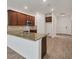 Open concept kitchen featuring wood cabinets, granite countertops, and stainless steel appliances at 118 Boxwood Ln, Rotonda West, FL 33947