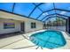 Screened-in pool, patio, and slider door leading to house at 118 Boxwood Ln, Rotonda West, FL 33947