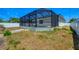 Screened-in pool area offers privacy and sun protection for outdoor enjoyment at 118 Boxwood Ln, Rotonda West, FL 33947