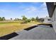 Backyard featuring a patio, landscaping, and beautiful views of a nearby golf course at 124 Rotonda Cir, Rotonda West, FL 33947