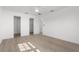 Spacious bedroom with wood-look floors, neutral paint, and a large closet at 124 Rotonda Cir, Rotonda West, FL 33947