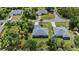 Single-story home with neat landscaping, nestled in a tranquil neighborhood surrounded by mature trees at 1275 Huntington St, North Port, FL 34288