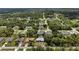 An elevated view captures a cozy neighborhood nestled among lush trees, creating a serene residential atmosphere at 1275 Huntington St, North Port, FL 34288