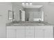 Bathroom features double sinks with granite countertops at 1275 Huntington St, North Port, FL 34288