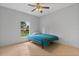 Cozy bedroom with tile floors, a ceiling fan, and a single bed at 1275 Huntington St, North Port, FL 34288