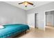 A bedroom with a ceiling fan and a closet at 1275 Huntington St, North Port, FL 34288