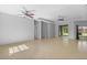 Open concept living room with tile floors and recessed lighting and access to the outdoor space at 1275 Huntington St, North Port, FL 34288