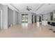 Bright living room with tile flooring, open layout, and sliding doors leading to an outdoor space at 1275 Huntington St, North Port, FL 34288