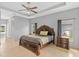Spacious main bedroom featuring a ceiling fan and two windows at 1275 Huntington St, North Port, FL 34288