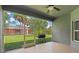 Spacious screened patio with a grill and a view of the backyard at 1275 Huntington St, North Port, FL 34288