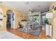View of the dining room with seating for eight, a decorative ceiling fan and light yellow walls at 1313 Wise Dr, North Port, FL 34286
