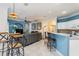 Open-concept space with bar, living area, and view into another room at 1313 Wise Dr, North Port, FL 34286