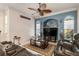 A spacious living room with a ceiling fan and a comfortable brown leather sectional at 1313 Wise Dr, North Port, FL 34286