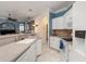 Bright kitchen featuring white cabinets, tile backsplash, and stainless-steel appliances at 1313 Wise Dr, North Port, FL 34286