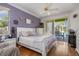 Light-filled bedroom with a ceiling fan and access to the outdoor pool area at 1313 Wise Dr, North Port, FL 34286