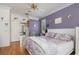 Cozy bedroom with wood flooring and an adjoining room in view at 1313 Wise Dr, North Port, FL 34286