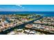 Aerial view of waterfront homes on canal with direct access to the open bay at 148 Peckham St Se, Port Charlotte, FL 33952