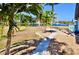 Landscaped backyard features stone path and waterfront access to the canal at 148 Peckham St Se, Port Charlotte, FL 33952