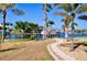 Landscaped yard with waterfront canal and lush greenery surrounding the property at 148 Peckham St Se, Port Charlotte, FL 33952
