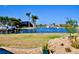 Waterfront backyard featuring boat dock, lush greenery and scenic canal views at 148 Peckham St Se, Port Charlotte, FL 33952