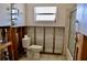 Bathroom in need of renovation features a toilet, tub, and exposed wall, creating a blank canvas at 148 Peckham St Se, Port Charlotte, FL 33952