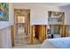 View of bedroom with closet and doorway amid exposed studs and tiled floor at 148 Peckham St Se, Port Charlotte, FL 33952