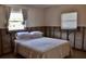 Bedroom with a comfortable bed, natural light, and incomplete drywall at 148 Peckham St Se, Port Charlotte, FL 33952