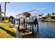 Elevated boat lift providing secure and convenient access to the waterfront canal at 148 Peckham St Se, Port Charlotte, FL 33952