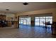 Large open-concept living area with a customizable design, bright natural light, and tile flooring at 148 Peckham St Se, Port Charlotte, FL 33952