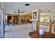 Open-concept living room with tile flooring, natural light, and lots of opportunity to customize at 148 Peckham St Se, Port Charlotte, FL 33952