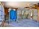 Living room showing a ladder and partially exposed ceiling with a view of the outside at 148 Peckham St Se, Port Charlotte, FL 33952