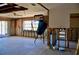 Unfinished Living Room with exposed studs, concrete floors and lots of light at 148 Peckham St Se, Port Charlotte, FL 33952