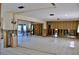 Large open-concept living area with a customizable design, bright natural light, and tile flooring at 148 Peckham St Se, Port Charlotte, FL 33952