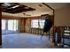 Spacious living room featuring sliding glass doors with unfinished walls and ceiling at 148 Peckham St Se, Port Charlotte, FL 33952