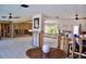 Open-concept living room with tile flooring, natural light, and lots of opportunity to customize at 148 Peckham St Se, Port Charlotte, FL 33952