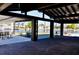 Expansive covered outdoor patio with canal waterfront views, complete with dining and lounge areas at 148 Peckham St Se, Port Charlotte, FL 33952
