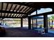 Large covered patio with an in-ground pool and stunning waterfront views at 148 Peckham St Se, Port Charlotte, FL 33952