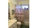 Bathroom featuring a vanity with a sink and a shower with a patterned shower curtain at 1488 Squaw Ln, North Port, FL 34286