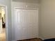 Bedroom featuring closet space and access to the rest of the home at 1488 Squaw Ln, North Port, FL 34286